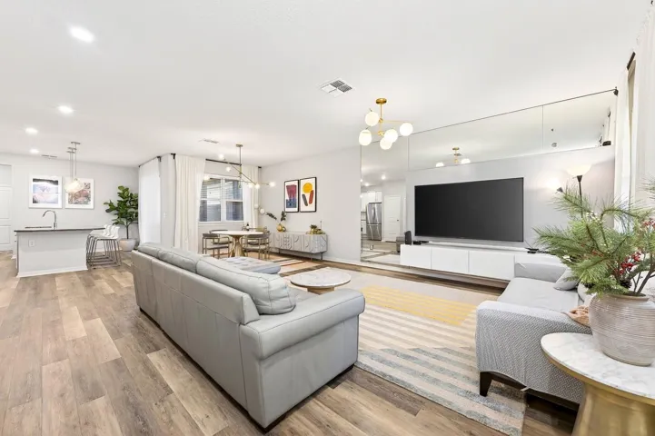 The expansive Living Room invites connection and comfort.