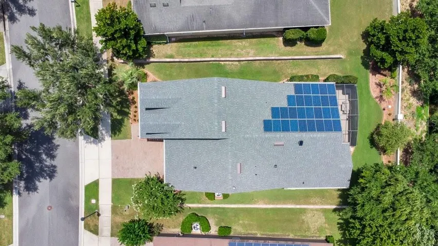 Aerial view of home with leased solar panels paid to 2034