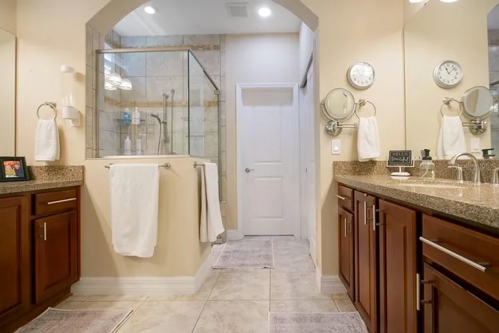 Owner's Bathroom with dual sinks and shower stall