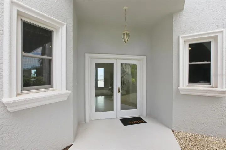 Ground floor entry under winding staircase