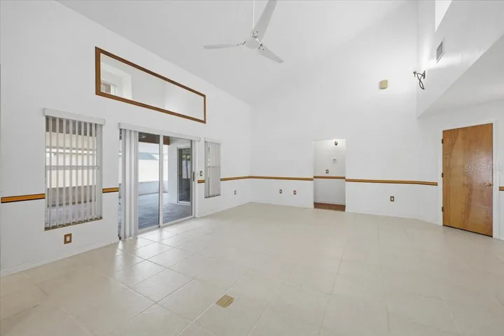 Living room looking to back screened patio