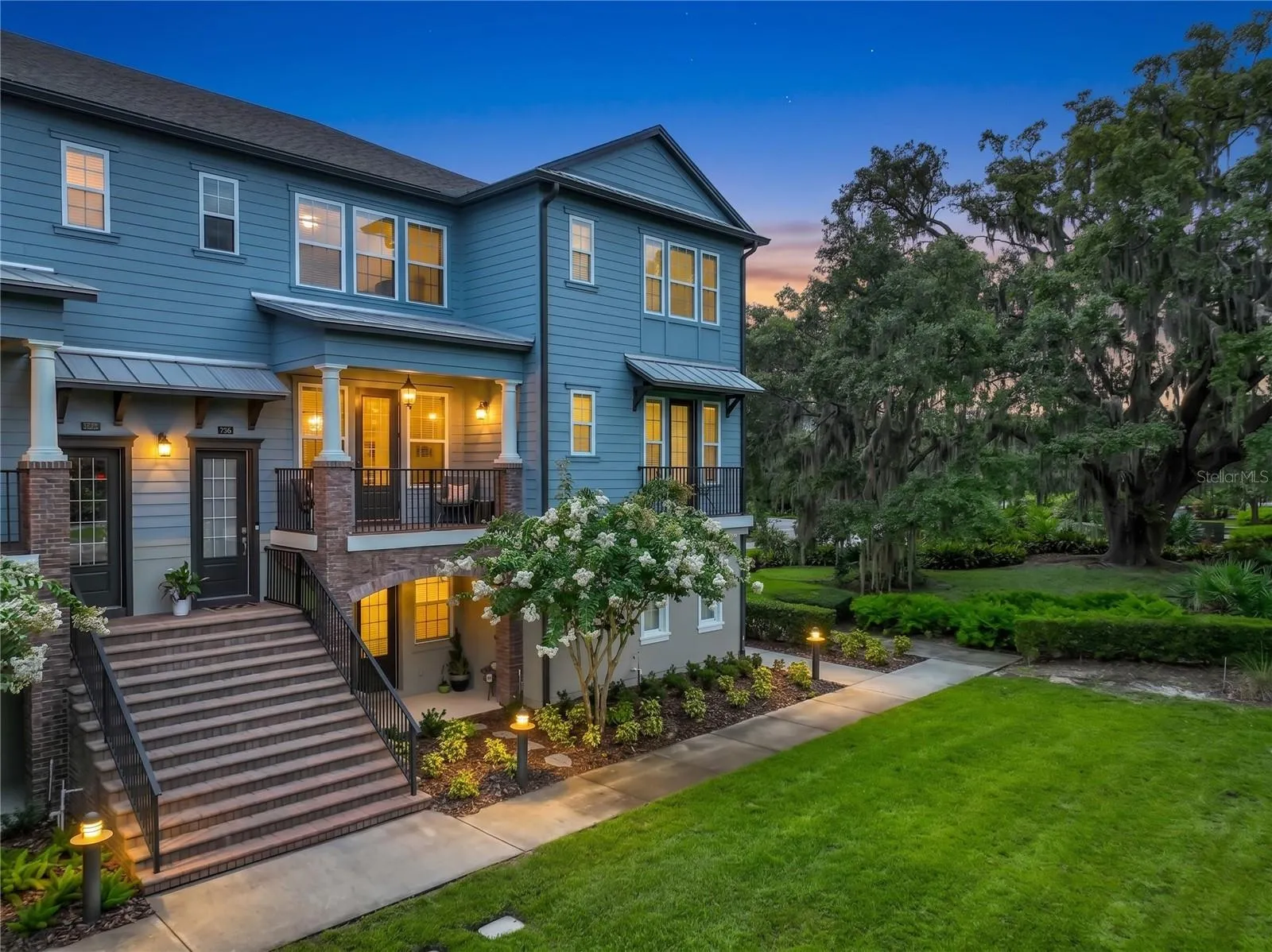 Twilight photo of front of property.