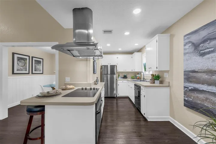Bright kitchen is open to the family room.