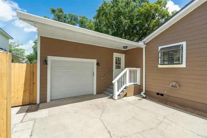 Extra-long garage with side entrance to the house.