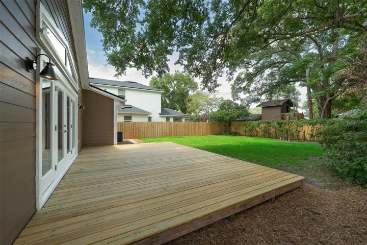 Brand new wood fence secures your back yard for your little ones or fur-baby.