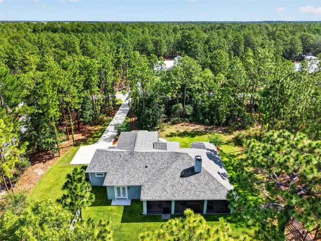 Aerial perspective of the backyard and grounds