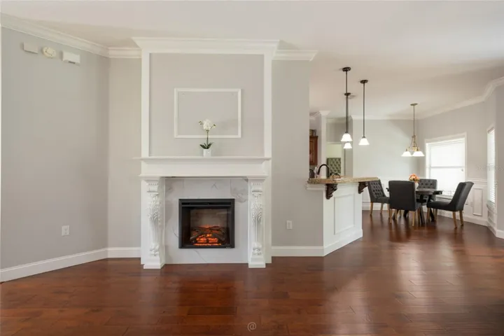Family Room w Fireplace and built in TV wall.