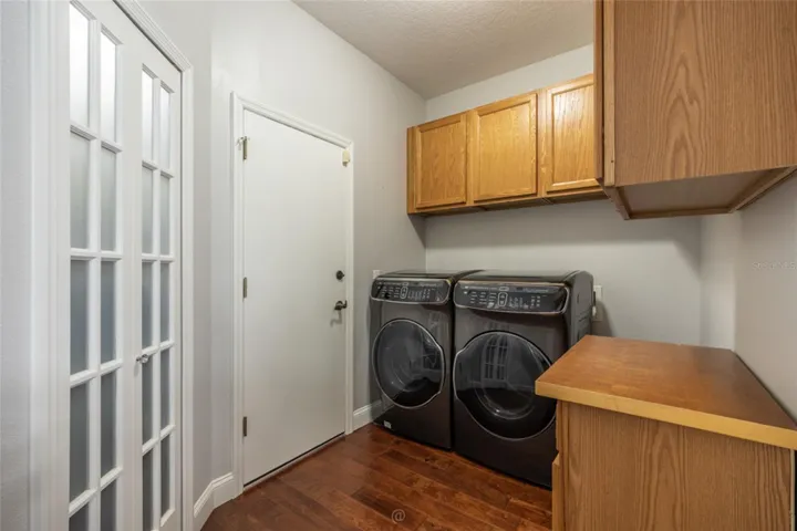 Laundry Room w plenty of storage and 2nd pantry