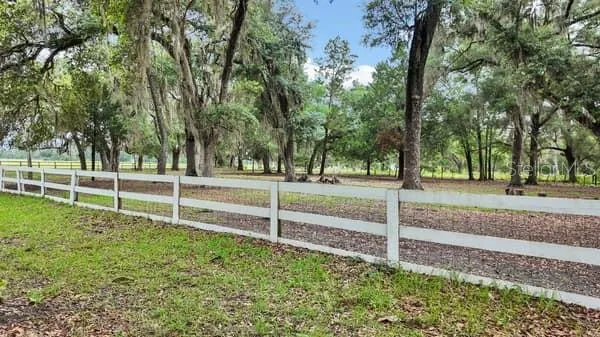 front white board fence over field fence