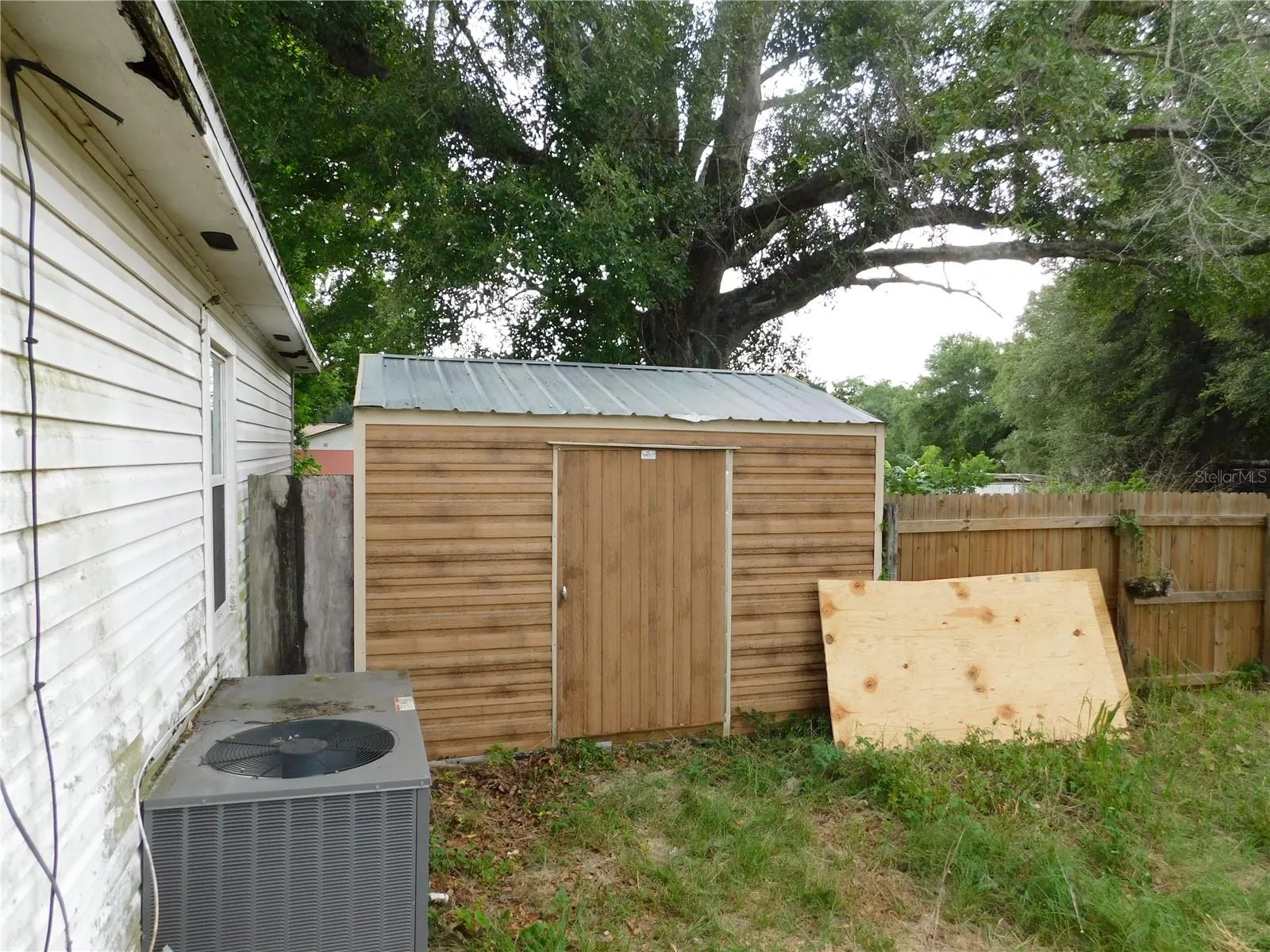 Storage shed like new condition in fenced yard of the first home