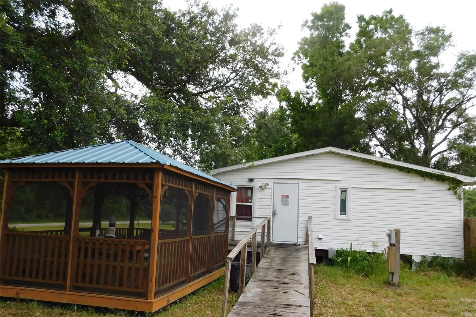 Side of home and side of Gazebo at main home