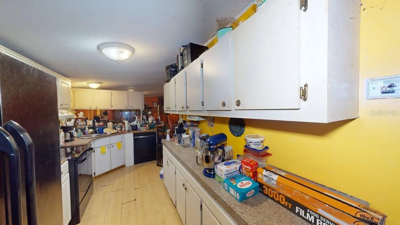 Kitchen view from the eat in space & laundry