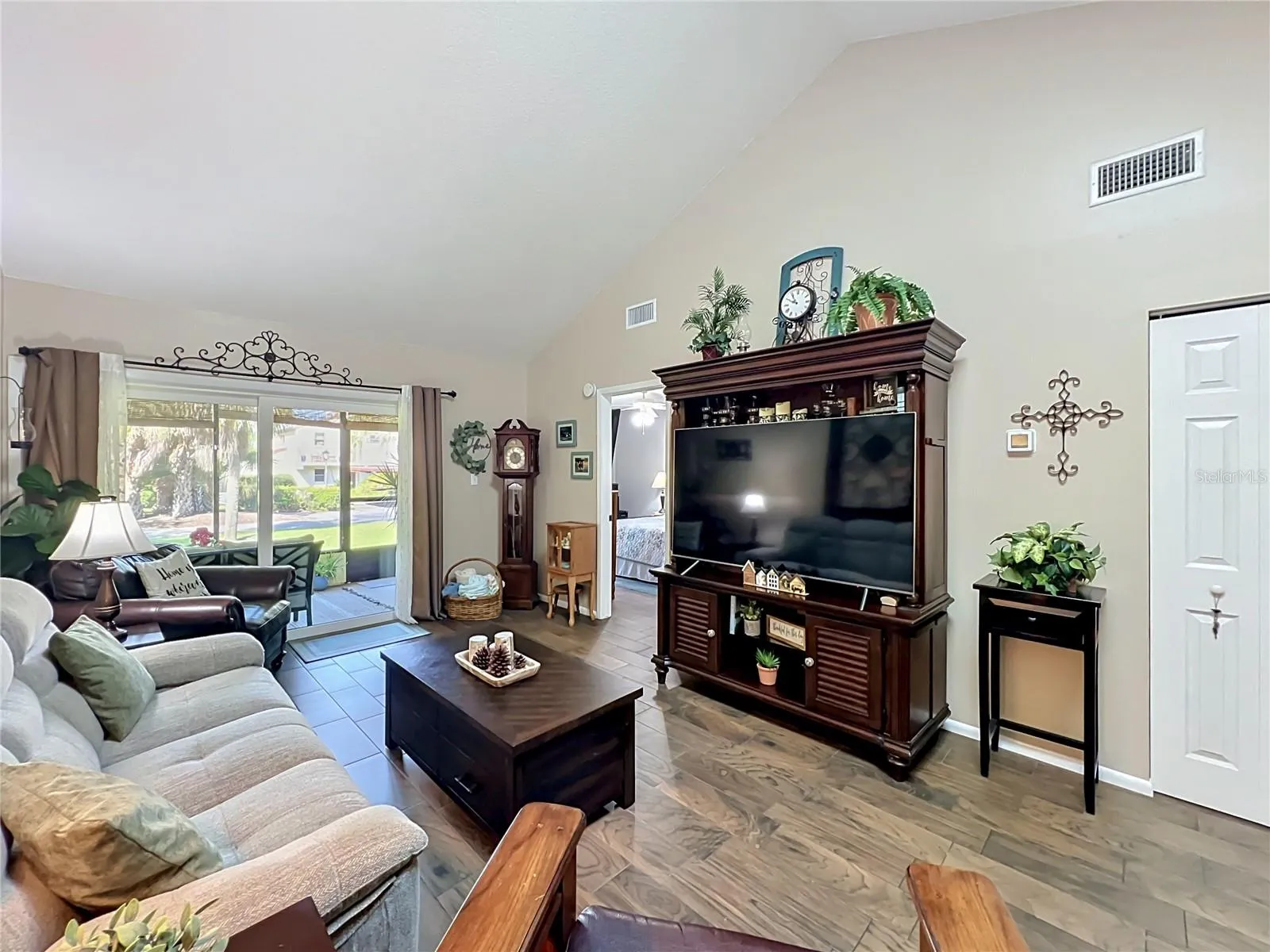 Living Room with Sliding Glass Doors to Screened-In Patio