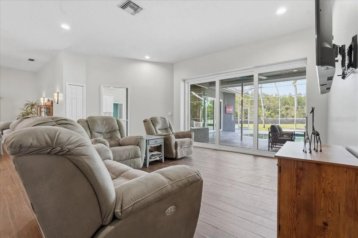 Living Room with triple double pane recessed sliding doors