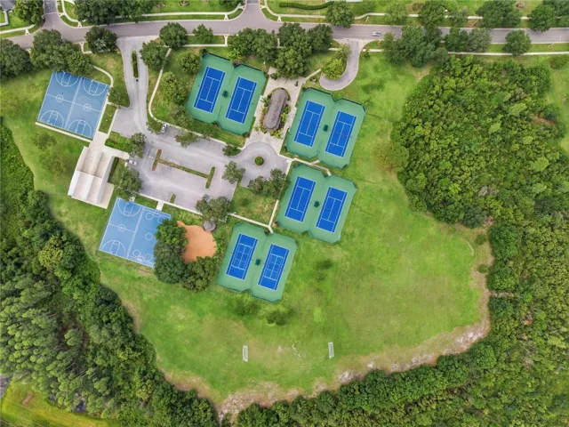 Aerial view of the Van Dyke Farms amenities around the Clubhouse. Tennis, Racquetball, Basketball, Hockey, Soccer & a Baseball Diamond.