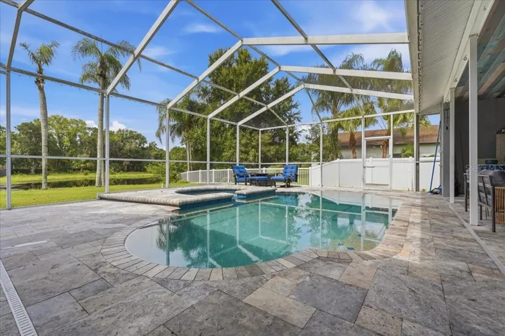 Travertine deck, spa and a new variable speed pool pump