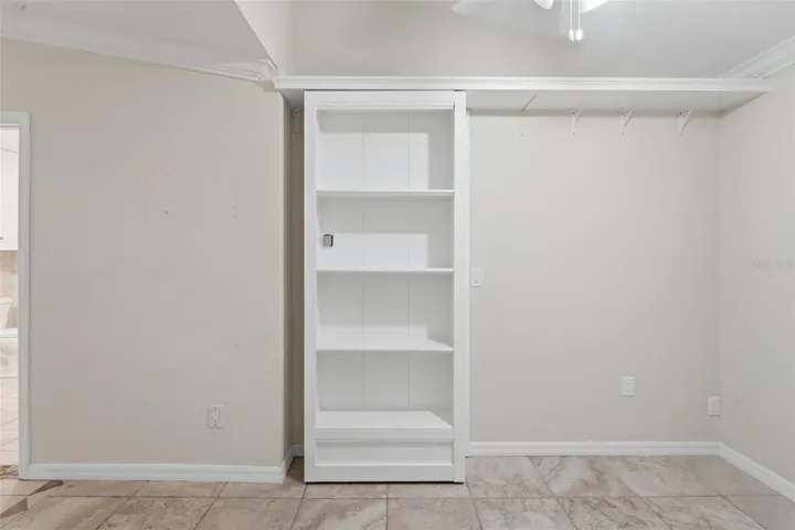 Shelf door to safe room
