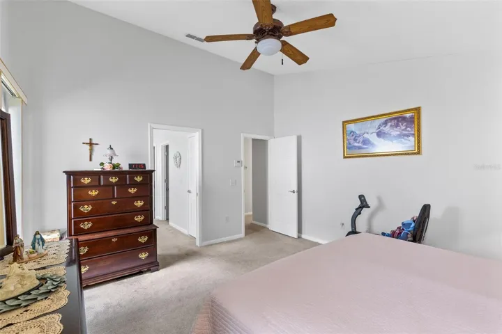 Vaulted ceilings make the primary bedroom feel larger.