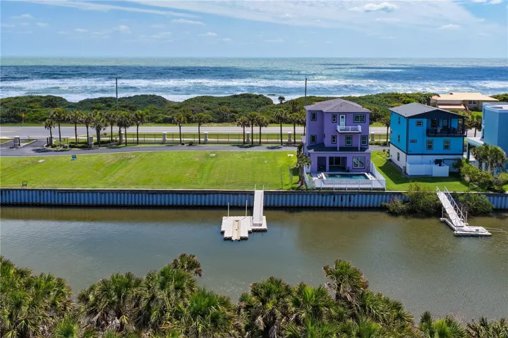Build your dream coastal retreat on this exceptional waterfront homesite featuring a private floating dock, Intracoastal access, and deeded beach access just steps from the Atlantic Ocean.