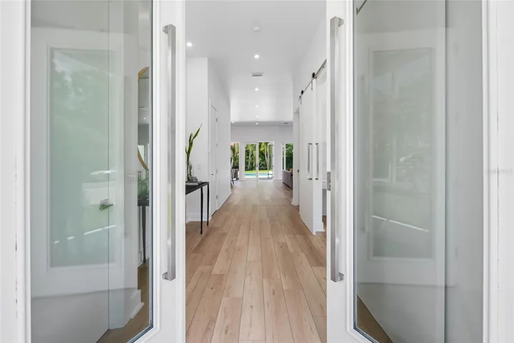 French glass doors welcome you into an impressive foyer