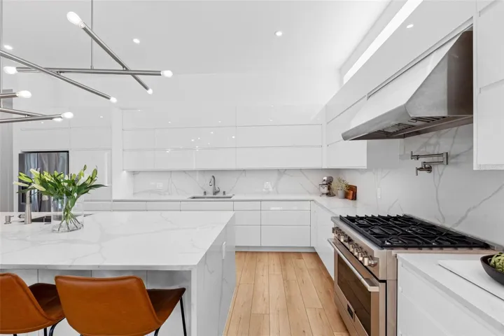 Custom kitchen boats solid drawer cabinetry system for functionality, Bloom soft closure hinges, cabinet to store everyday appliances, 2 sinks with disposal, 6 burner 36