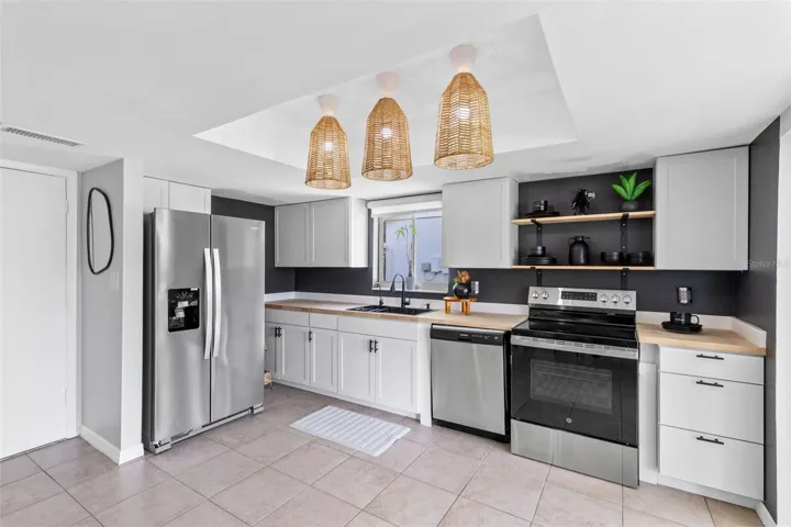 Upgraded lighting and NEW appliances in the kitchen