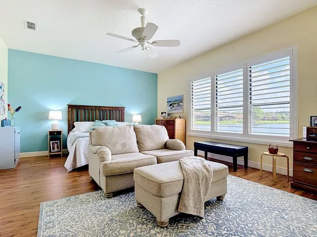 Wake up to this exquisite view of the water in the primary bedroom suite