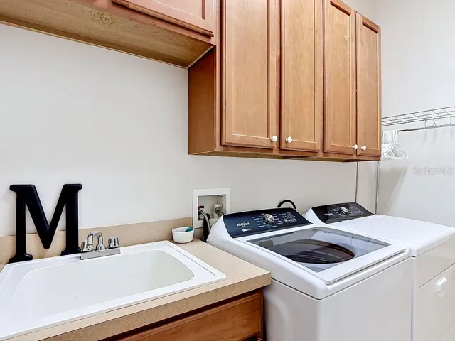 Utility tub with cabinet
