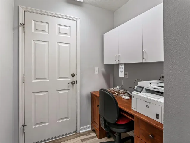 Mud rm w/Cabinets & access to garage (currently used as office)