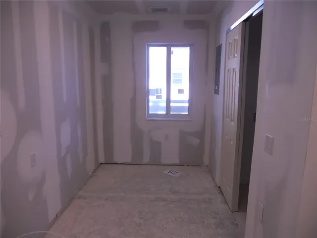 KITCHEN AREA COULD HAVE ADDITIONAL CABINETS OR DESK AREA. LAUNDRY/HVAC CLOSET ON RIGHT.
