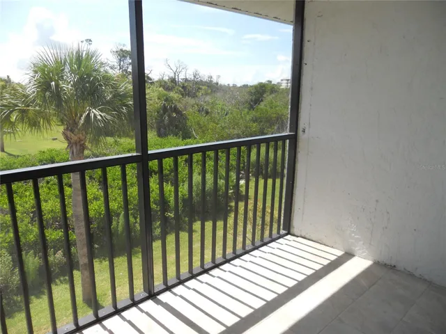 BALCONY HAS VIEW OF CREEK WITH MANGROVE TREES.