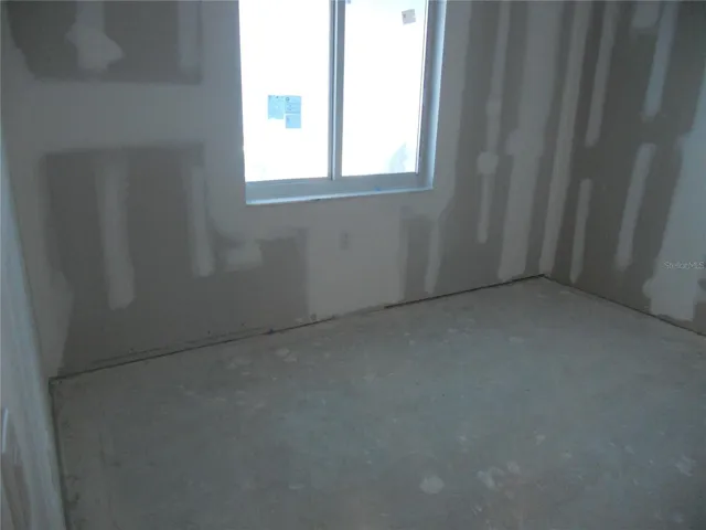 BEDROOM #2 HAS NEW HURRICANE IMPACT WINDOW WITH SCREEN.