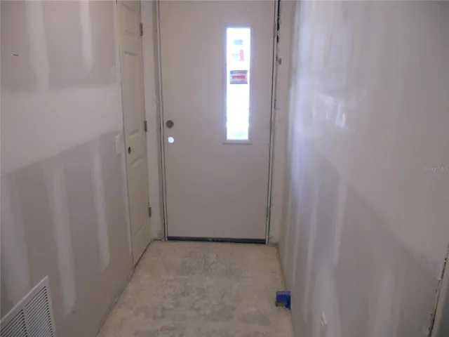 FRONT DOOR ENTRANCE INTO HALLWAY.