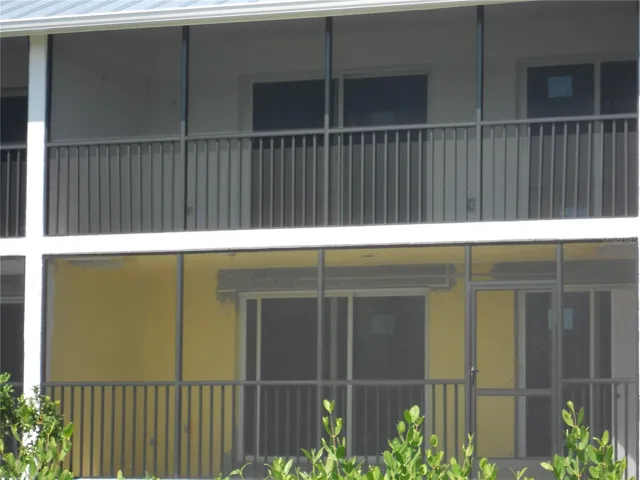 2ND FLOOR UNIT. BACK VIEW. NEW RAILING AND SCREEN.