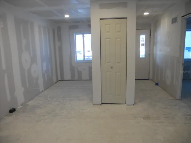 KITCHEN AREA WITH PANTRY CLOSET. NOOK IN BACK LEFT CORNER CAN ACCOMIDATE CABINETRY WIH DESK AREA AND LAUNDRY CLOSET.