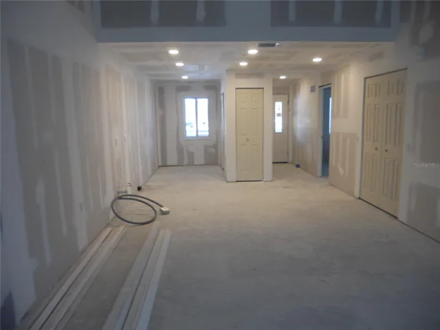 VIEW OF THE LIVING TOWARDS WHERE THE KITCHEN WOULD BE INSTALLED.