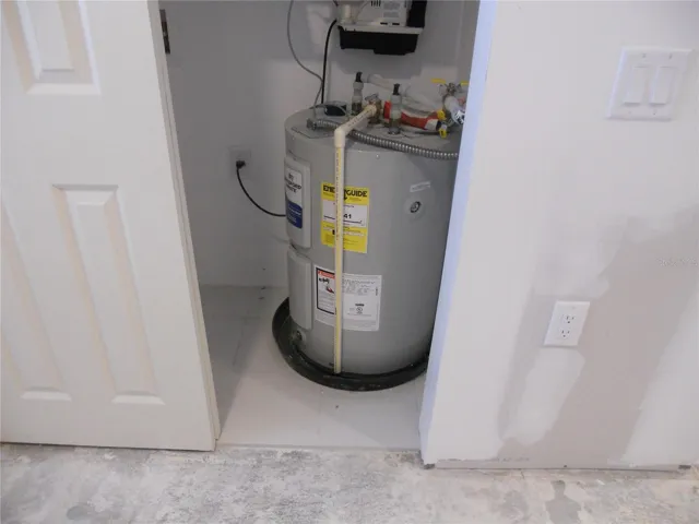 NEW WATER HEATER. NOTE THE WATER IS CONNECTED TO THE BUILDING. THE UNIT HAS NO WATER TURNED ON RIGHT NOW.