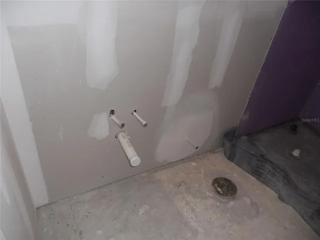 VANITY, COMMODE AND SHOWER HAS BEEN ROUGHED IN AND READY FOR CABINETRY, FIXURES AND TILE.
