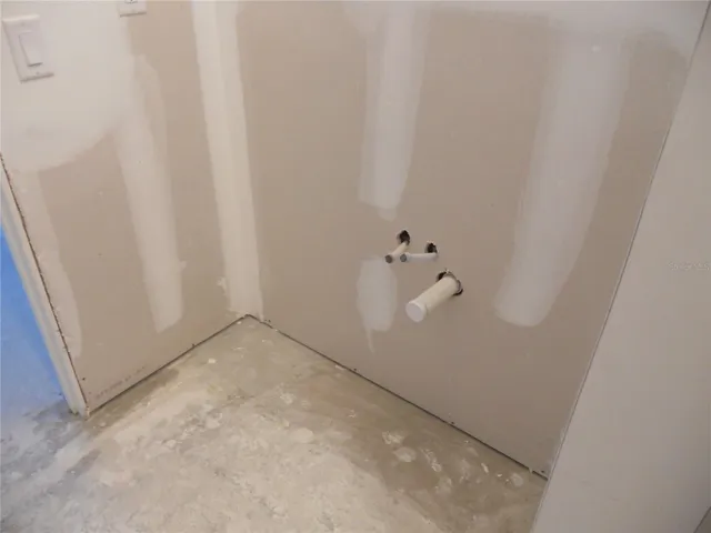 PRIMARY BATHROOM VANITY AREA IS ROUGHED IN AND READY FOR CABINETS TO BE INSTALLED.