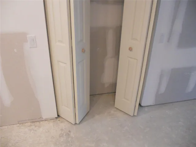 STORAGE CLOSET IN LIVING ROOM.