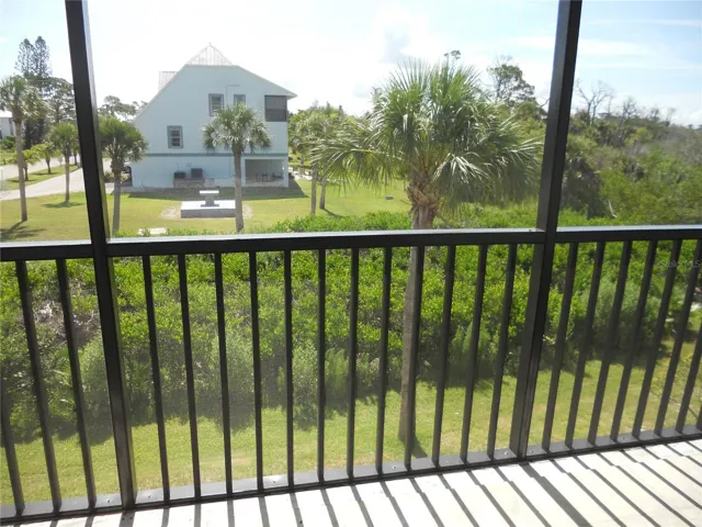 BALCONY HAS NEW RAILING AND SCREEN.