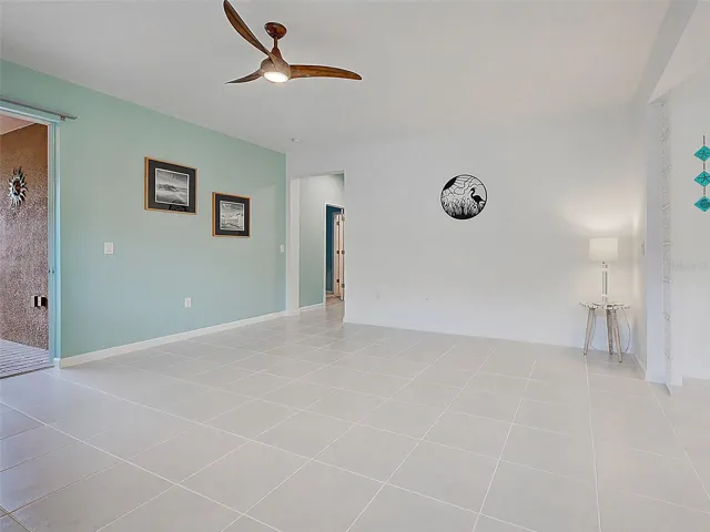 Living room with Fan and sliders to Lanai