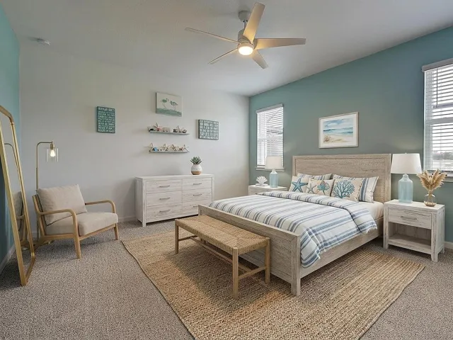 17' x 14' Primary bedroom with ceiling fan, custom paint, new carpet and virtual decor