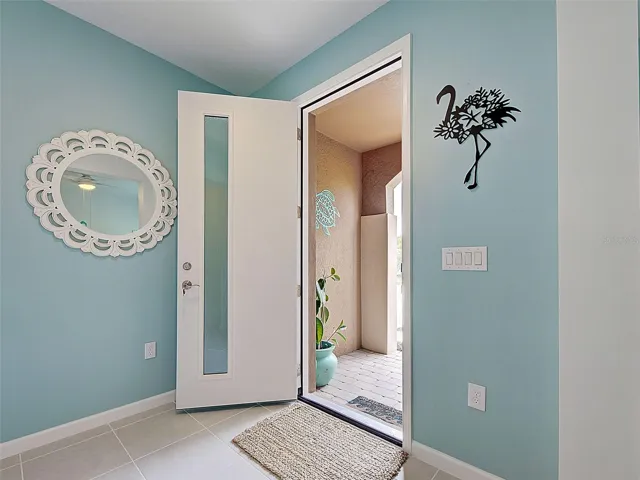 Solid core hurricane rated door with impact glass