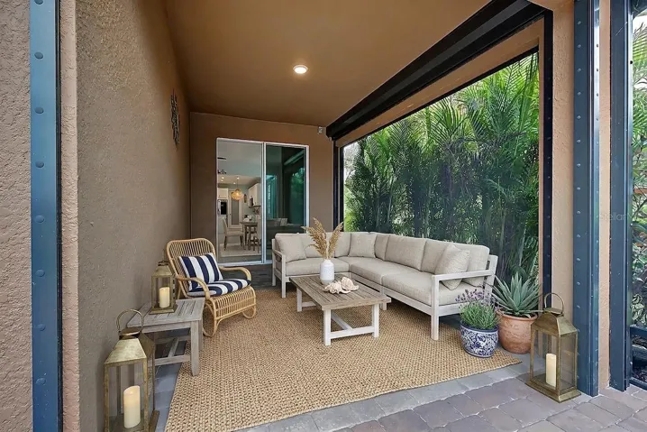 Covered lanai area with storm shutters and virtual decor
