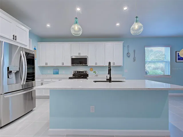 Stunning Kitchen with smart refrigerator, microwave and double oven. Upgraded sink.