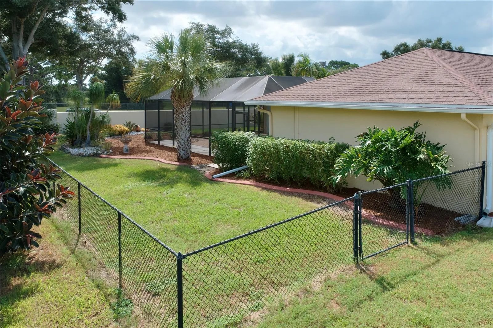 Large Fenced, grassed backyard