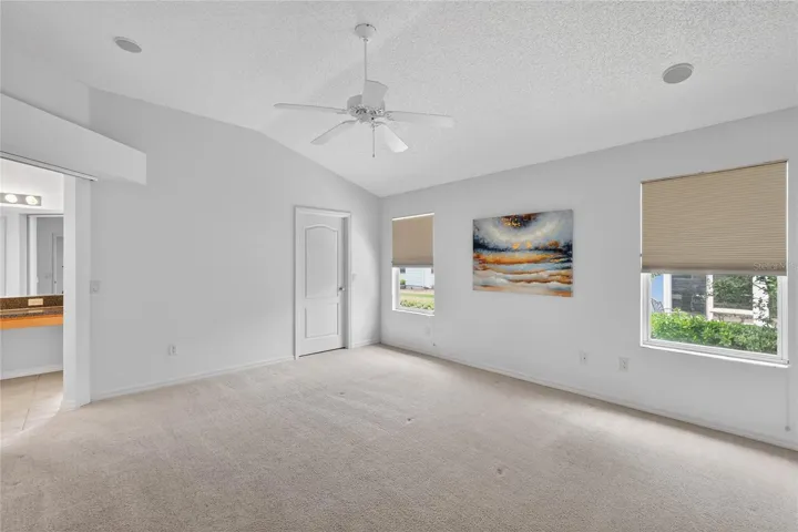 The spacious primary suite offers TWO WALK-IN CLOSETS