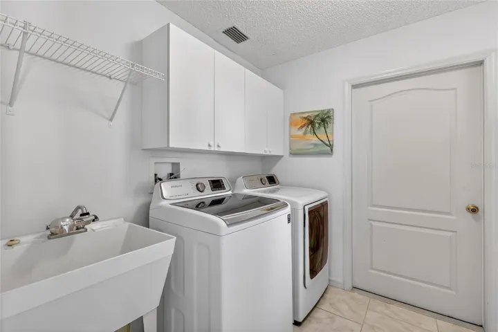 Inside laundry with set sink