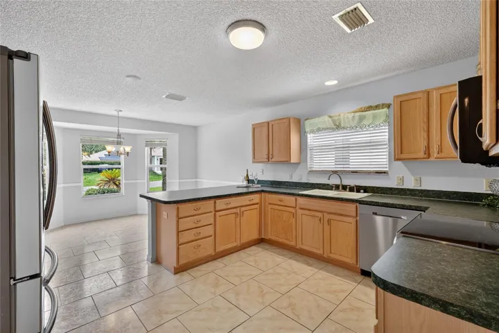 The eat-in kitchen is designed for both functionality and comfort